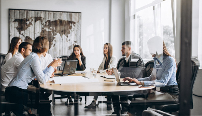 People sitting around a desk